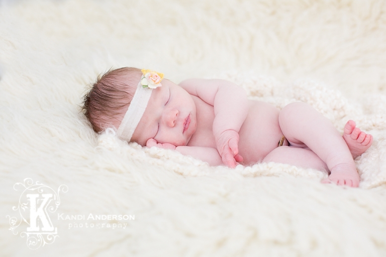 baby on white blanket with gorgeous headband web_G1A9723