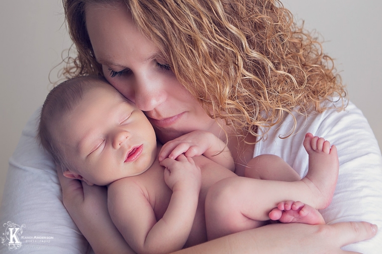 mom snuggling her miracle baby boy photos