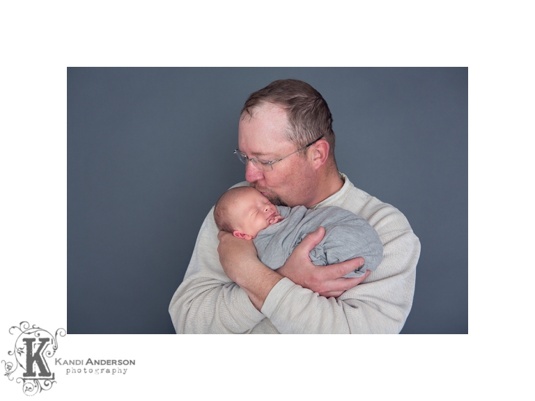 dad kissing baby and snuggling newborn elko nv