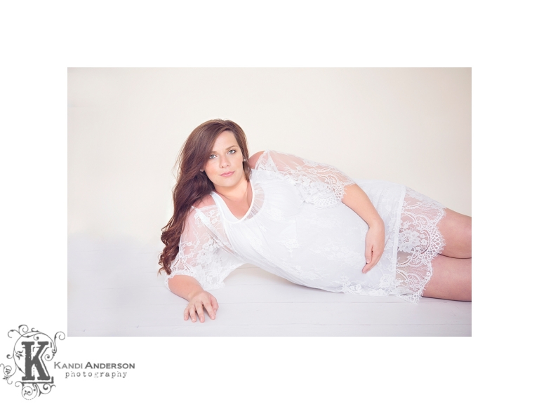 beautiful expectant mom in a white lace top offered in Kandi Anderson's wardrobe collection
