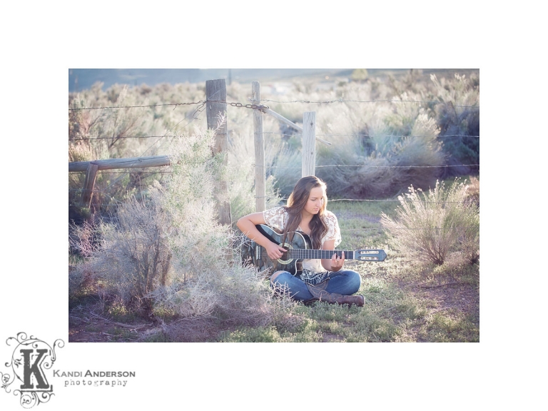 girl in field playing guitar