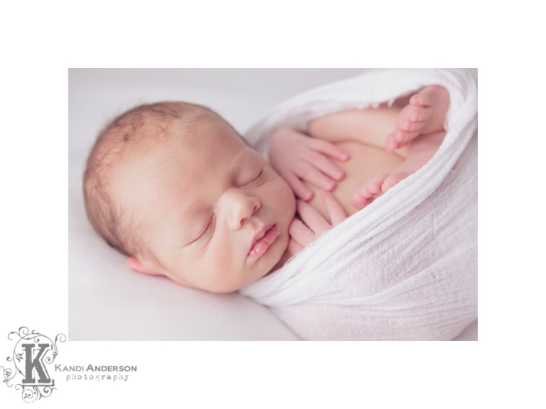 newborn baby boy swaddled in organic cloth